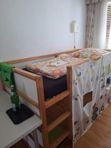 a bunk bed in a room with a bed at Forstoase Deister in Bredenbeck