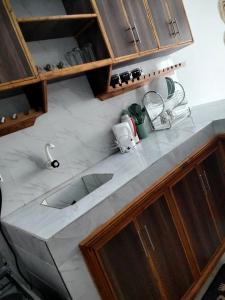 an overhead view of a kitchen counter with a sink at MahaliaLuxuryStays in Malindi