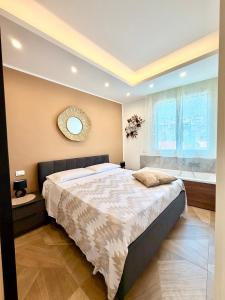 a bedroom with a large bed and a bath tub at Las Palomas in Santa Flavia