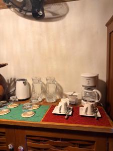 a kitchen counter with appliances on top of it at Guest House Antsakoa in Nosy Komba