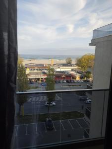 a view of a parking lot from a building at Solid House - Sunrise Apartment in Mamaia
