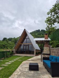 a house with a pitched roof at Aurarest - აურარესთ in Makho