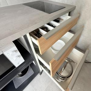 a kitchen with a sink and a counter top at Glamping chatky in Spišské Tomášovce
