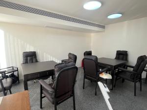 a waiting room with black chairs and tables at Book NOW & Chat, Wake in Mountain,Free Shuttle,Aside National Park, Combo Stay in Tianmen city center, English Speaking Assistant in Jiawan +67 photos