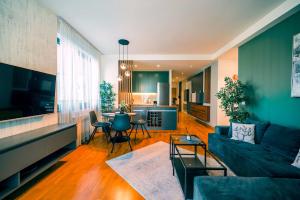 a living room with a couch and a table at BW Cityline Residences in Belgrade