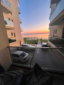 a view from a balcony of a parking lot with a car at Solid House Apartment - Sea View in Mamaia