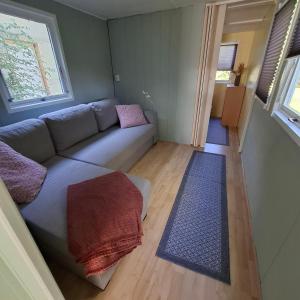 a living room with a couch and a window at casabandow in Schwaan