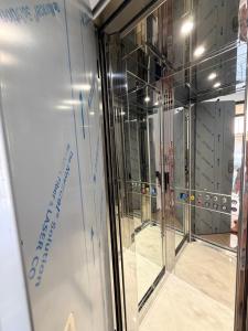 a group of glass doors in a room at Las Palomas in Santa Flavia +39 photos