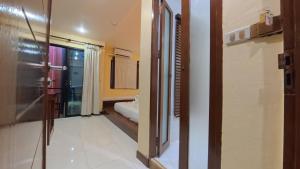 a room with a bed and a window at Azure Stays Patong in Patong Beach +77 photos
