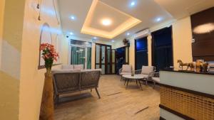 a living room with a couch and a table at Azure Stays Patong in Patong Beach