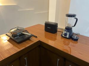 a blender sitting on top of a wooden counter at Double T in Dickwella