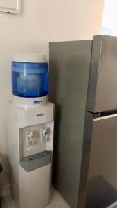 a food processor sitting on top of a refrigerator at Beachview Serenity at Canyon Cove in Nasugbu