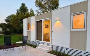 a house with a patio and a table and chairs at Masseria La Torre in Maglie