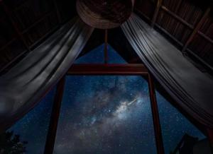 a view of the milky way from a room with hammocks at Tao Resort in Andavakonko +1 photo