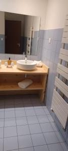 a bathroom with a sink and a mirror at Abries Hôtel in Abriès