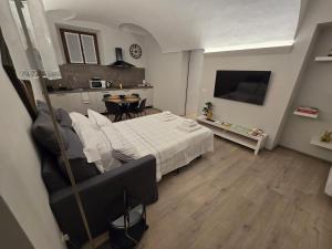 a bedroom with a bed and a dining room at Zia Rina in Bra