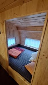 En eller flere senge i et værelse på Hütte 28