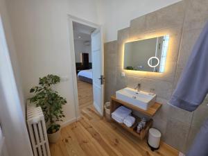 a bathroom with a sink and a mirror at Villa Aestival in Saint-Symphorien