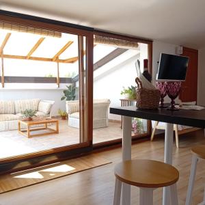 a living room with a large sliding glass door at La Dimora di Deborah Terrazza Panoramica, Centro & Stazione a 4 min, Relax e Comfort in Montecatini Terme