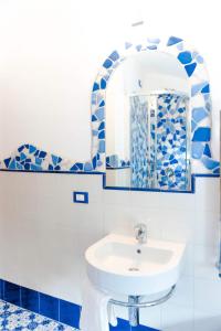 a bathroom with a sink and a mirror at Villa Borgo San Michele in Amalfi +92 photos