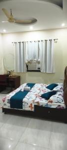 a bedroom with a bed and a window at The duggar villa in Jammu