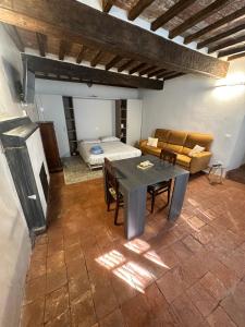 a living room with a table and a couch at Casa Michele in Pontremoli