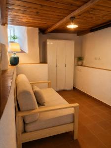 a room with a bed and a cabinet in it at Suite Il Mulino - Sea View in Sperlonga