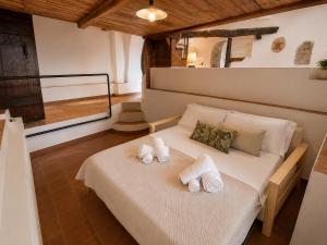 a bedroom with a bed with towels on it at Suite Il Mulino - Sea View in Sperlonga