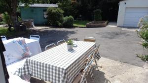 a table with a potted plant sitting on top of it at The Post Office, 6 beds, Bar, Library, Pool Table, Stream, Large Garden in Piddletrenthide +77 photos