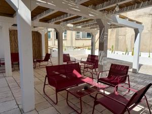 a group of chairs and tables on a patio at Dimora Storica Palazzo Didonna in Rutigliano