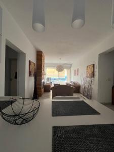 a living room with a couch and a table at Paradise House in Lefkandi Chalkidas