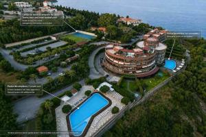 a rendering of a building next to the water at Milazzo. Intero alloggio in affitto in Milazzo