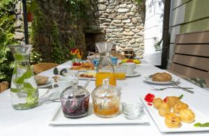 a white table with food and drinks on it at Penzion Vila Julie in Jilemnice