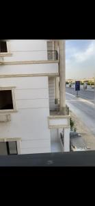 a white building on the side of a street at Tetou Hotel Cairo in Cairo