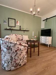 a living room with a couch and a table at Misses Greenday in Bad Suderode