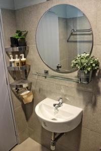 a bathroom with a sink and a mirror at Ku at sea in Ko Samed