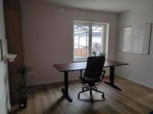 an empty room with a table and a chair at Sleeping house in Cluj-Napoca