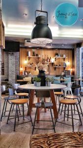 a dining room with a table and chairs at Ku at sea in Ko Samed