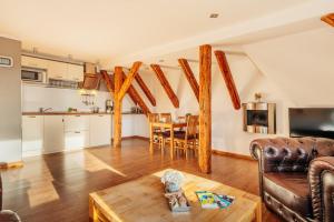 a living room with a couch and a table at Bergpanorama in Sankt Andreasberg