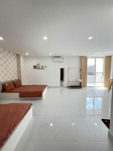 a bedroom with a bed and a chalkboard in a room at Hạt Nắng House - Gò Vấp in Ho Chi Minh City