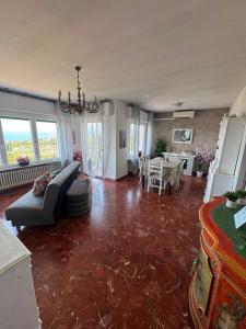 a living room with a couch and a table at Viola Apartment Monte Felice in Bardolino