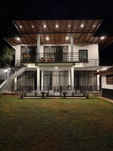 a building with a balcony and stairs on it at SIORA Retreat in Dambulla