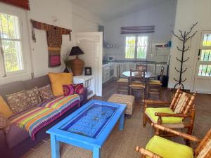 a living room with a couch and a table at Descansadero in Bolonia