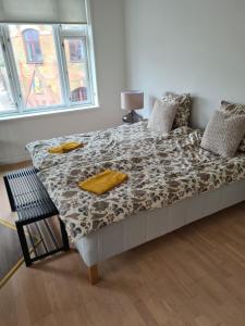 a large bed in a room with a window at Damm Hotell in Frederikshavn +12 photos