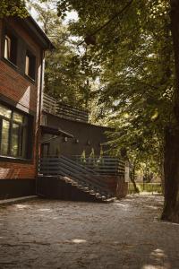 a group of people sitting on the side of a building at Apartament w Parku 2 in Żywiec