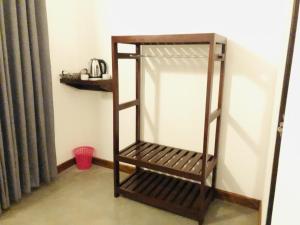 a shelf in the corner of a room at wild elephant reach wilpattu in Nochchiyagama +12 photos
