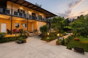 a house with a courtyard with a patio at my home in Kutaisi