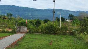 a gate on the side of a road at Pucayacu Wasi in Sauce +1 photo