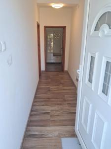 a hallway leading to a room with a door at Apartment Nikola R in Žabljak
