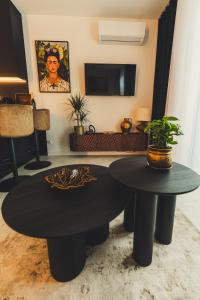 a living room with a table and a tv at Jacuzzi Siesławska Top Apartment in Busko-Zdrój